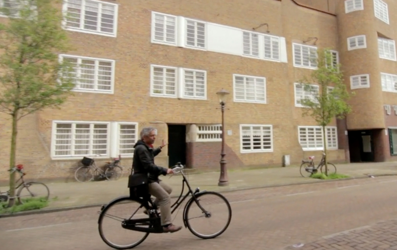 Man Cycling a bike in Amsterdam