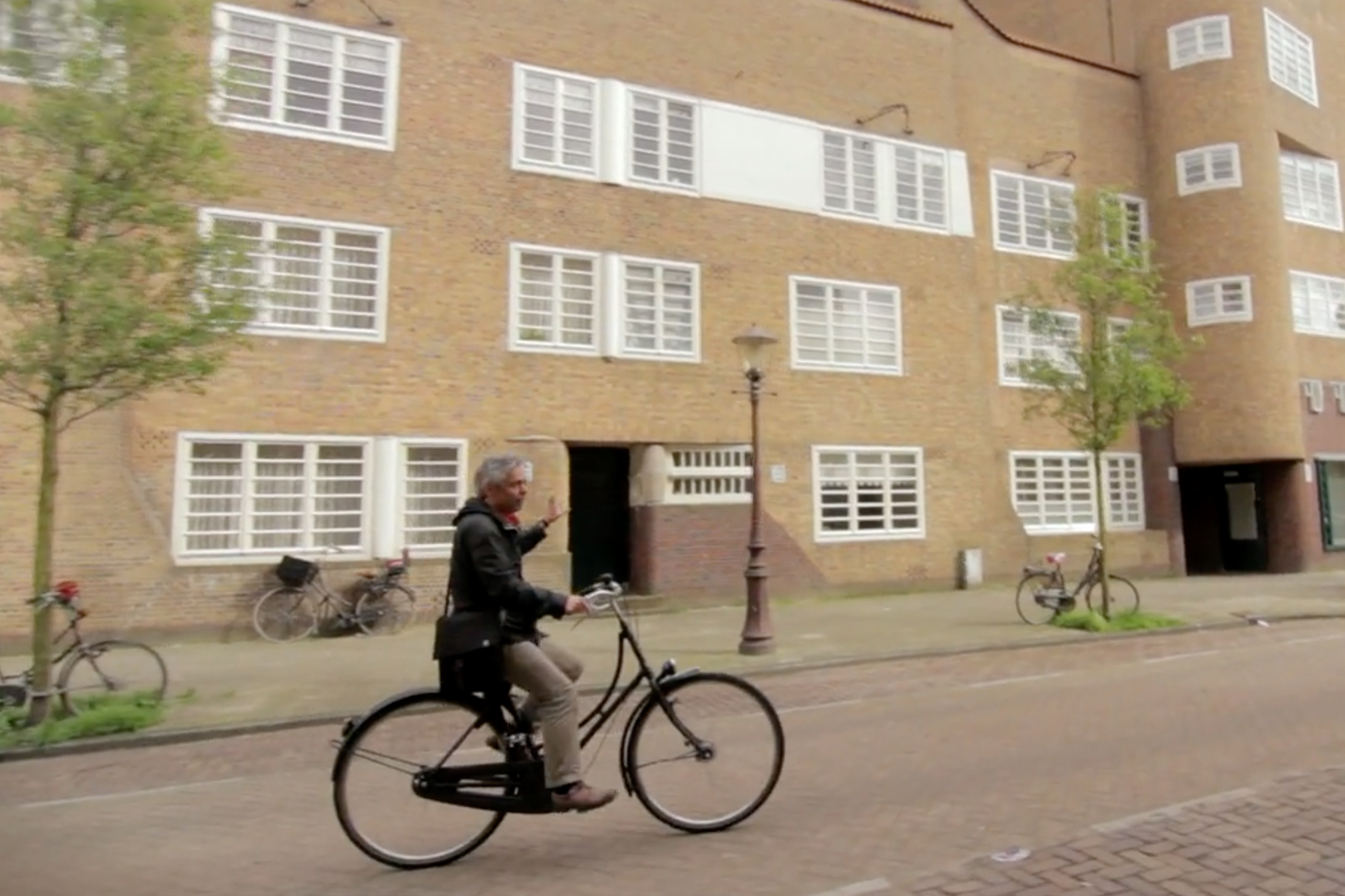 Man Cycling a bike in Amsterdam